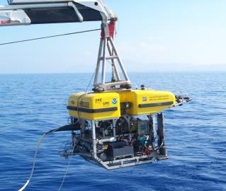 Hercules being lowered into the water for the dive on Kolumbo