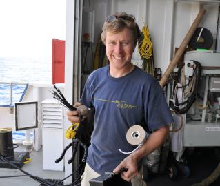 ROV engineer and pilot Todd preparing a special arm for working with the corals.