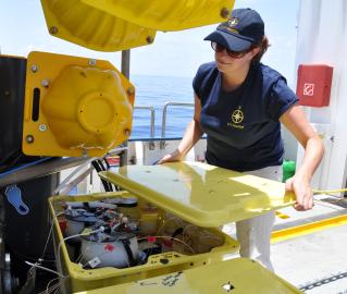 Senior scientist Beth opens up one of the sample boxes.