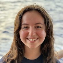 Sara Vahdatshoar stands in front of the ocean