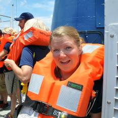 The port pilot climbs down the rope to the pilot boat.