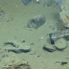 Close up Photo of Bottles and Sextant