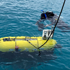 Mesobot in water with a diver