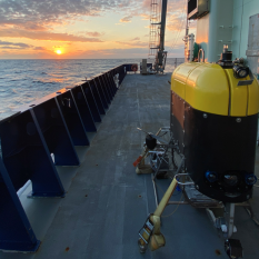 Mesobot on deck of ship at sunset