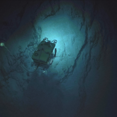 ROV hercules looking at cliff wall