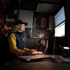 Malia Evans looks at a monitor in the Nautilus control van