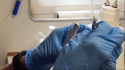 close up of hands removing an eDNA filter