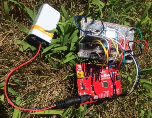 Arduino boards on the ground in grass