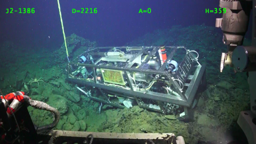 ROV Argus seen resting on the seafloor below ROV Hercules